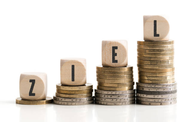 istock stacked coins showing a growing graph with cubes and the word 