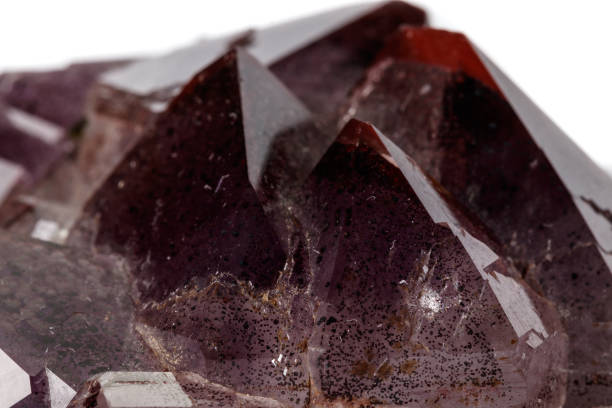 istock Macro mineral stone Amethysts, Goethite, Epidote on a white background 1129441507