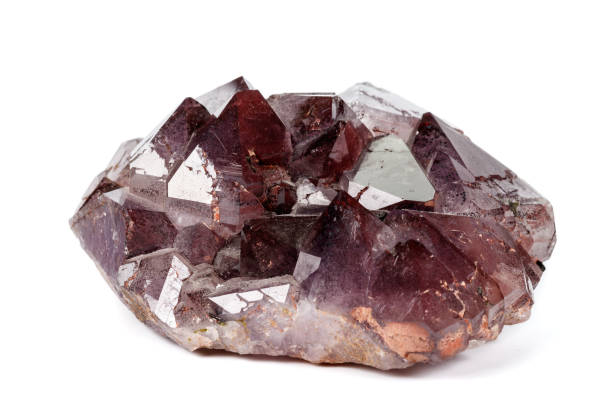 istock Macro mineral stone Amethysts, Goethite, Epidote on a white background 1129441527
