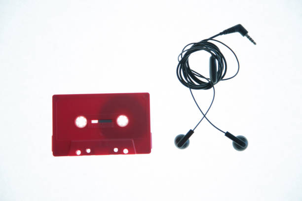 istock Vintage cassette tape and whitte earphone isolate 1129441548