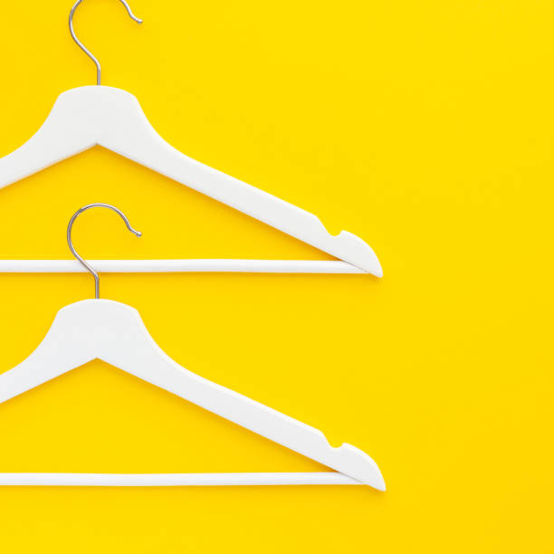 istock White hangers background for sale shopping concept 1129442473