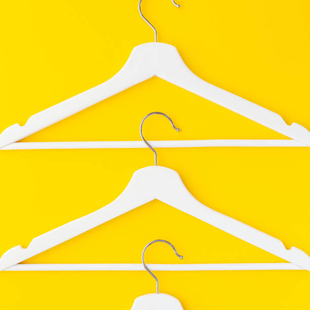 istock White hangers background for sale shopping concept 1129442482