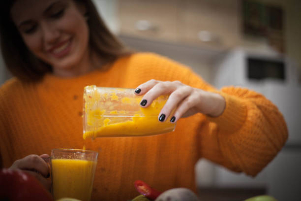 istock Vegetarian preparing vegan smoothie. 1129444735