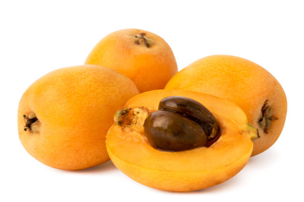 istock Ripe medlar and half with bone on a white, isolated. 1129445639