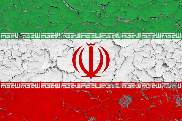 istock Flag of Iran painted on cracked dirty wall. National pattern on vintage style surface. 1129449613