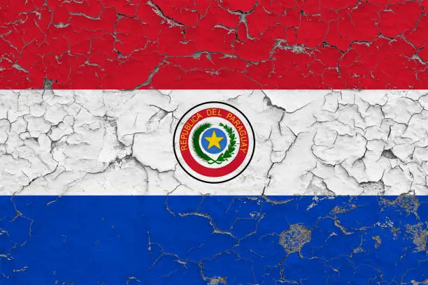 Photo of Flag of Paraguay painted on cracked dirty wall. National pattern on vintage style surface.