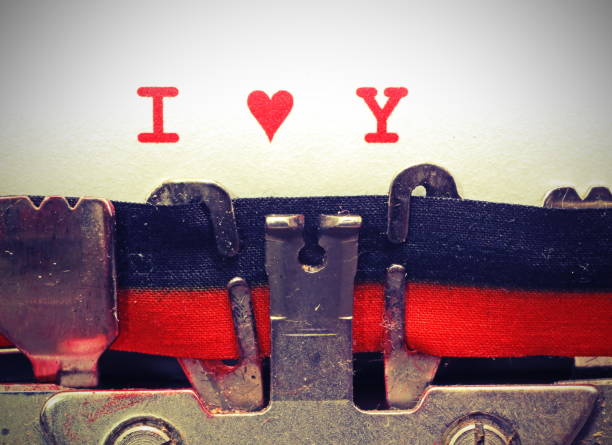 istock text by typewriter I LOVE YOU with heart with vintage toned effe 1129454462