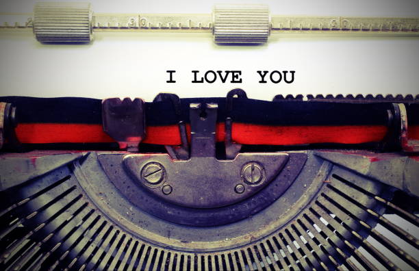 istock text by typewriter I LOVE YOU with black ink with vintage toned 1129454606