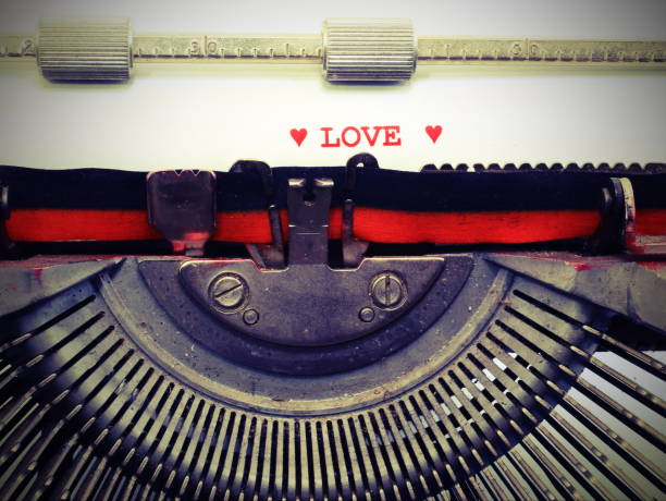 istock text by LOVE with red ink with vintage toned effect 1129454855