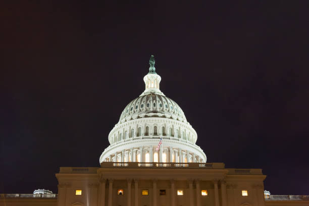 istock US capitol building at night.  Dome close-up. 1129455533
