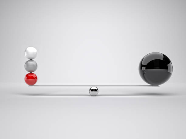 istock Close-Up Of Balls Balancing Against White Background 1129455590