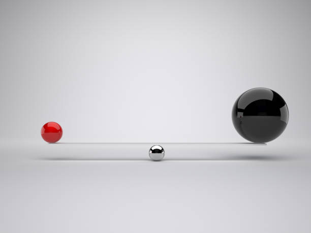 istock Close-Up Of Balls Balancing Against White Background 1129455593