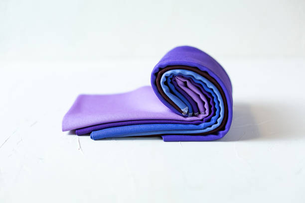 istock Colorful fabric swatches rolled up on white 1129457834