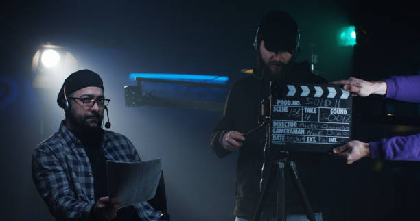 istock Young director giving instructions on a film set 1129464245