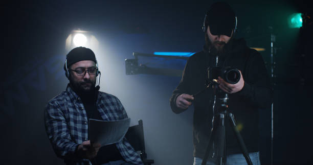 istock Young director giving instructions on a film set 1129464248