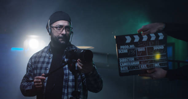 istock Young director giving instructions on a film set 1129464250
