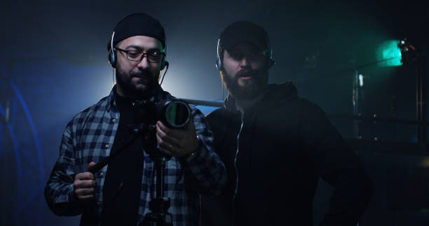 istock Filmmakers setting photo camera on stage 1129464253