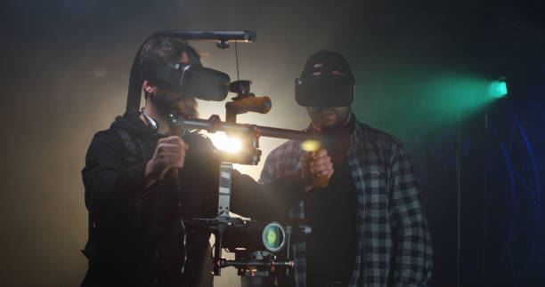istock Director instructing a cameraman on a film set 1129464254