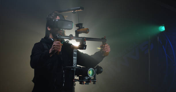 istock Bearded man in harness for camera equipment 1129464256
