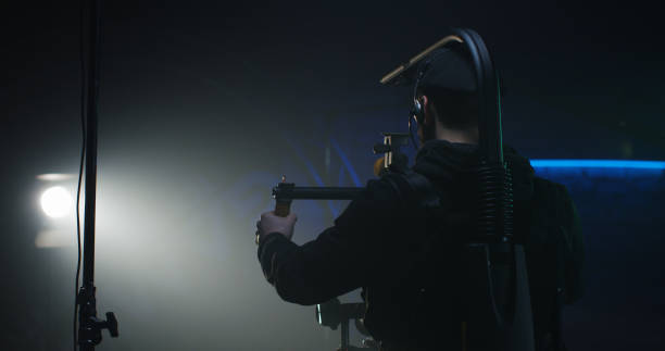 istock Young cameraman shooting a scene 1129464267