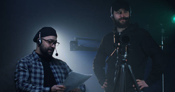 istock Young director giving instructions on a film set 1129464298