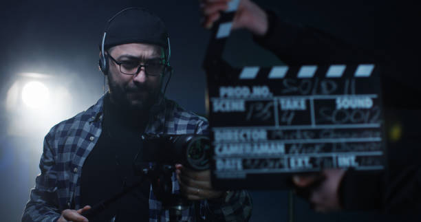 istock Young director giving instructions on a film set 1129464307
