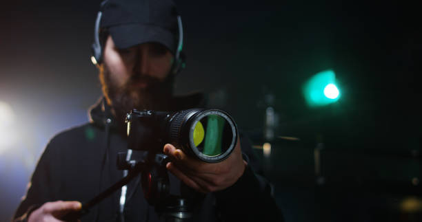 istock Young cameraman shooting a scene 1129464348