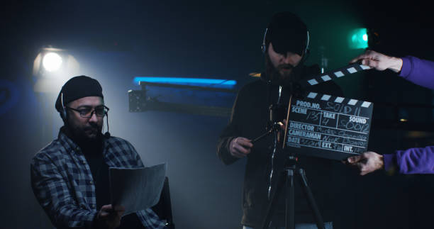 istock Young director giving instructions on a film set 1129464349
