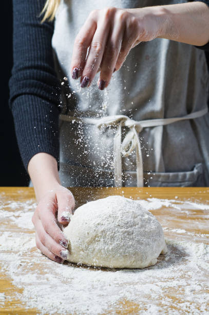istock Chef hands cooking dough. Top view 1129466075