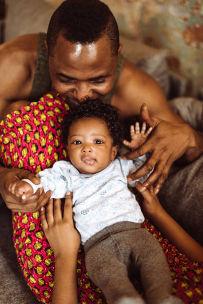 istock african family have fun in the sofa 1129466693