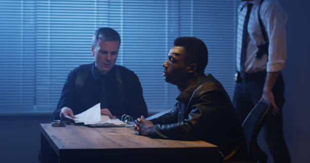 istock Police examining black man about drugs 1129468288