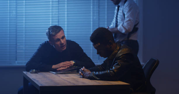 istock Police examining black man about drugs 1129468291