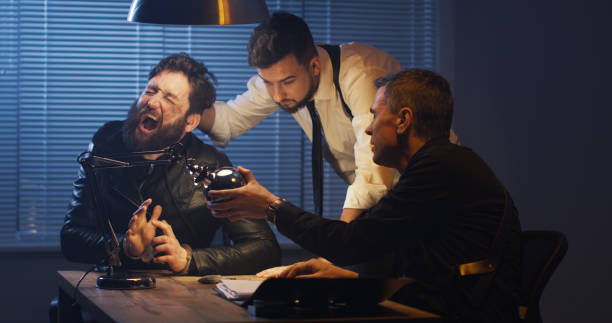 istock Policemen interrogating a drug dealer 1129468366