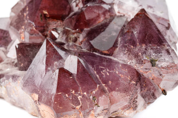 istock Macro mineral stone Amethysts, Goethite, Epidote on a white background 1129468715