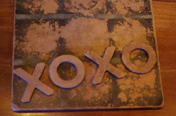 istock XOXO written with tic-tac-toe tokens 1129472652