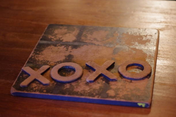 istock XOXO written with tic-tac-toe tokens 1129472653