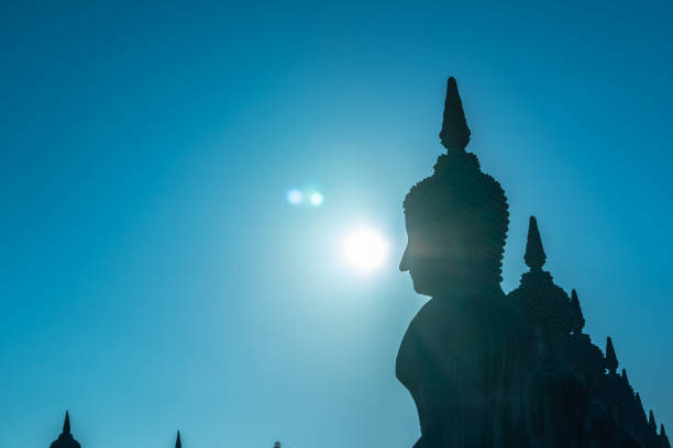 istock a lot of big Buddha statues in blue sky 1129481420