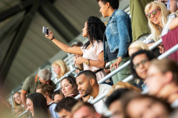 istock African-American woman taking a selfie on a stadium 1129484492