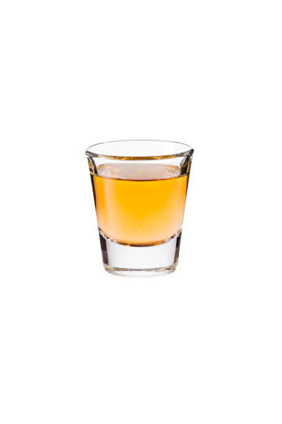 istock Refreshing Whiskey Shot Glass on White 1129484527