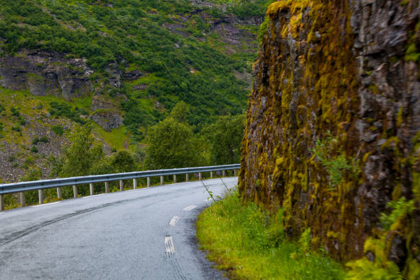 istock Turn of the mountain road. 1129485906