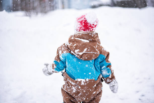 istock Child in the snow 1129488991