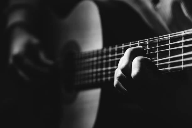 istock Midsection Of Man Playing A Guitar, black And White 1129490803