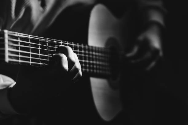 istock Midsection Of Man Playing A Guitar, black And White 1129490839