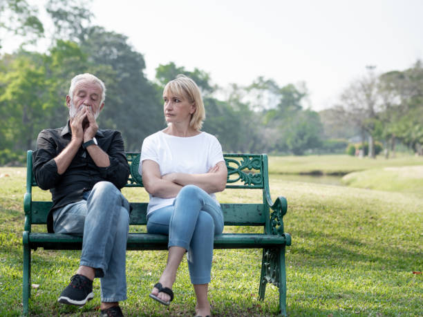 senior couple having problem, conflict, sadness, do not understand in a park. - arguing senior adult conflict couple imagens e fotografias de stock