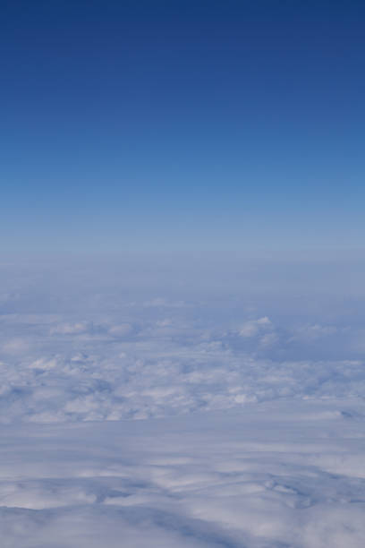 istock White clouds seen from an airplane seen under clouds 1129493507