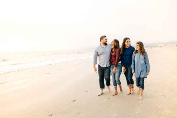 istock Sunset at the beach with family 1129495918