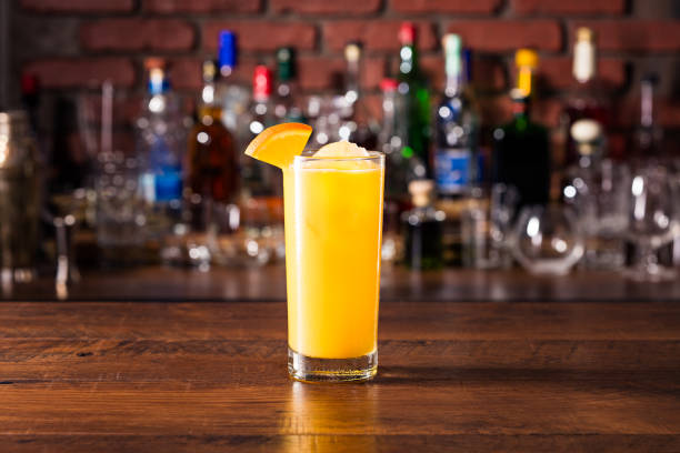 Refreshing Vodka OJ Screwdriver Cocktail Refreshing Vodka OJ Screwdriver Cocktail on a Bar screwdriver stock pictures, royalty-free photos & images