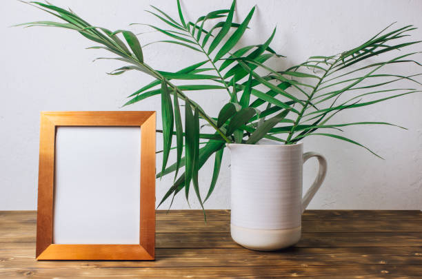 istock Stylish interior design with tropical leaves 1129498431