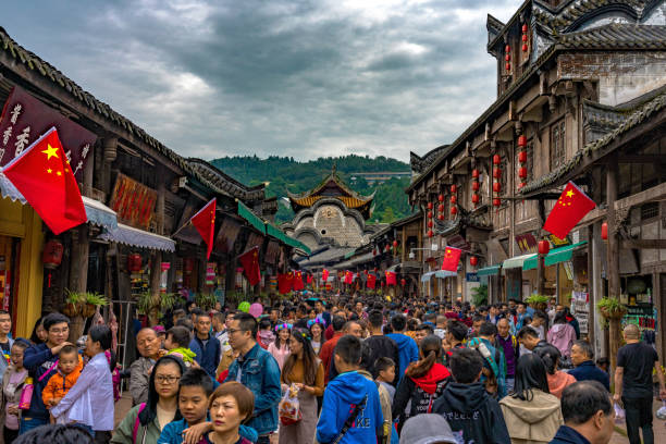 Busy scene of Luodai ancient town during the Golden week This is a view of a crowded street in Luodai ancient town during the Golden Week national holiday on October 02, 2018 in Chengdu chengdu photos stock pictures, royalty-free photos & images