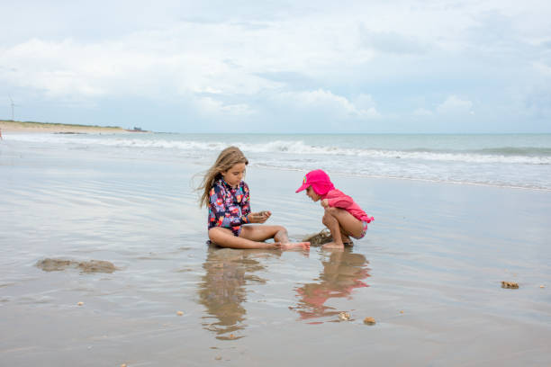 istock Children play on the beach during the holidays 1129502240